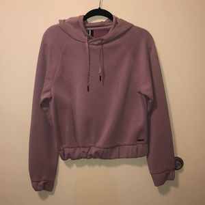 A pink/purple toned Hoodie